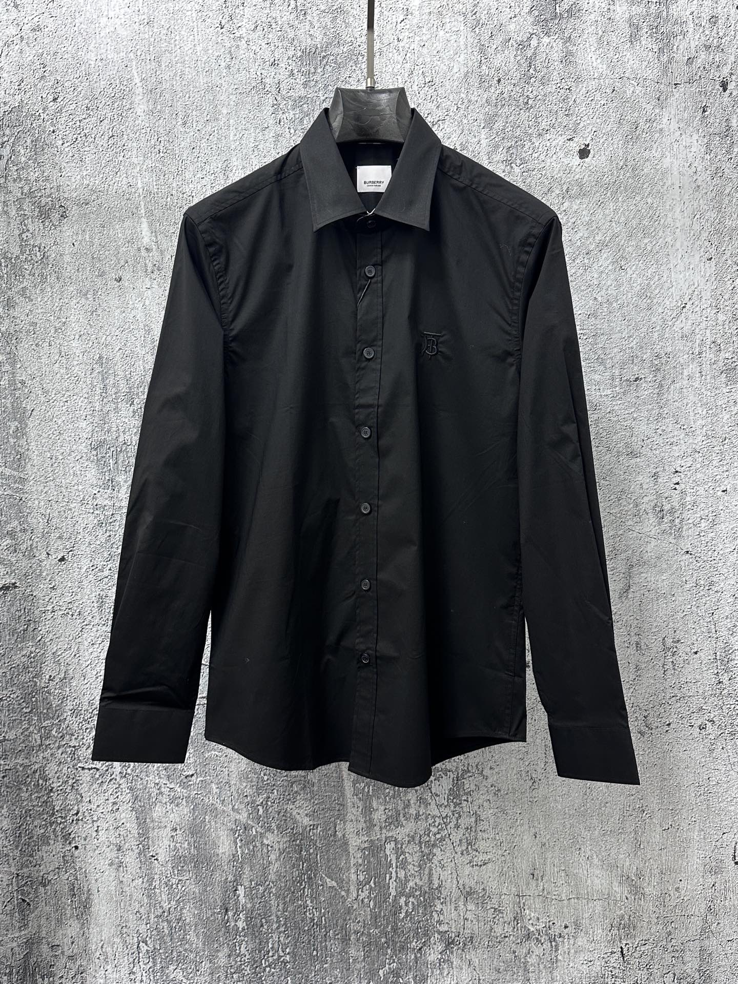 Burberry long-sleeve button-up shirt in black, front view with stand collar