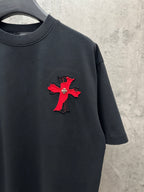 Black short-sleeve T-shirt with small red cross applique on chest