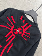 Black T-shirt with large red radial cross embroidery and pocket-like panel