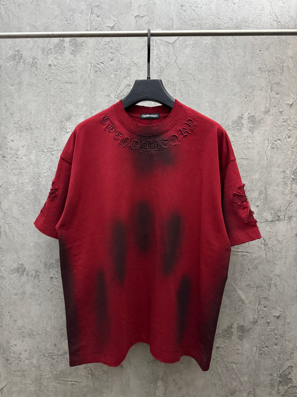 Red short-sleeve T-shirt with embroidered chest cross graphic