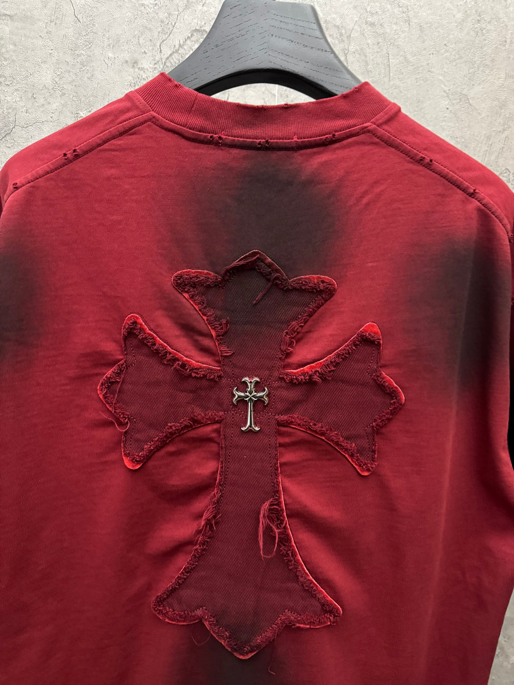Red short-sleeve T-shirt back with large cross floral appliqué centered