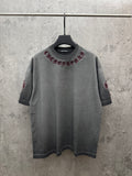 Grey short-sleeve T-shirt with maroon embroidered chest graphic and neckline logo patch