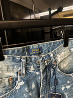 Light-wash denim jeans waistband with POLO Ralph Lauren logo and speckles