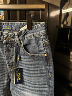 Light blue denim jeans with curved front pocket openings and POLO Ralph Lauren hang tag