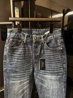 Light blue denim jeans with contrast-stitched pockets and POLO Ralph Lauren logo tag