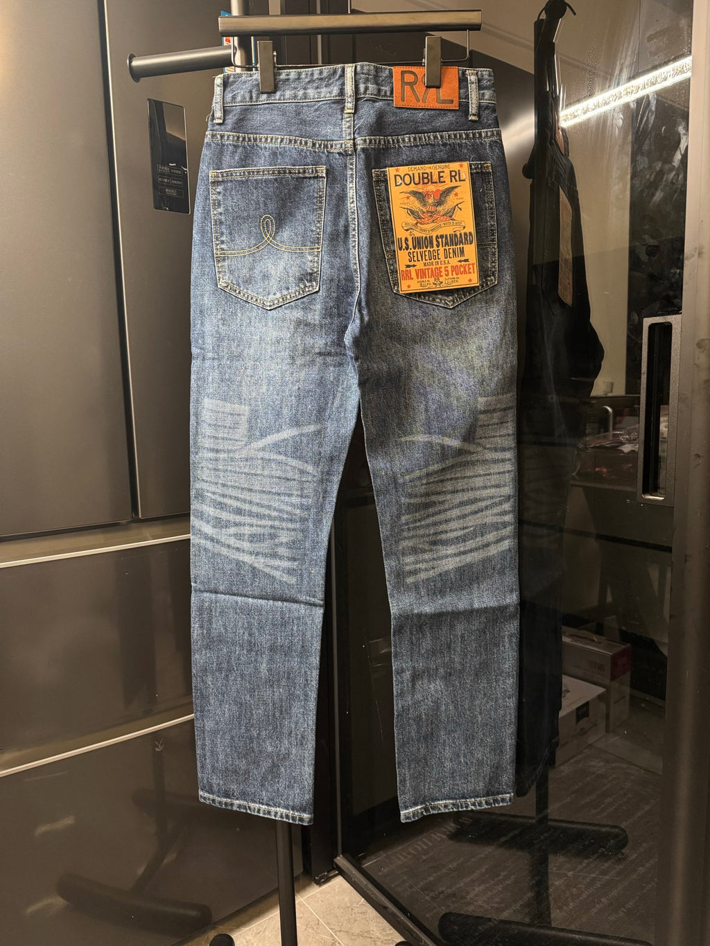 Light blue denim jeans with back patch pockets and POLO Ralph Lauren logo tag