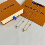 Louis Vuitton pendant necklace set with silver and gold-tone V charms