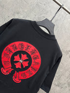 Black short-sleeve T-shirt with large red back flower graphic print