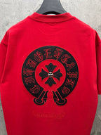 Red short-sleeve T-shirt featuring large back circular flower emblem.