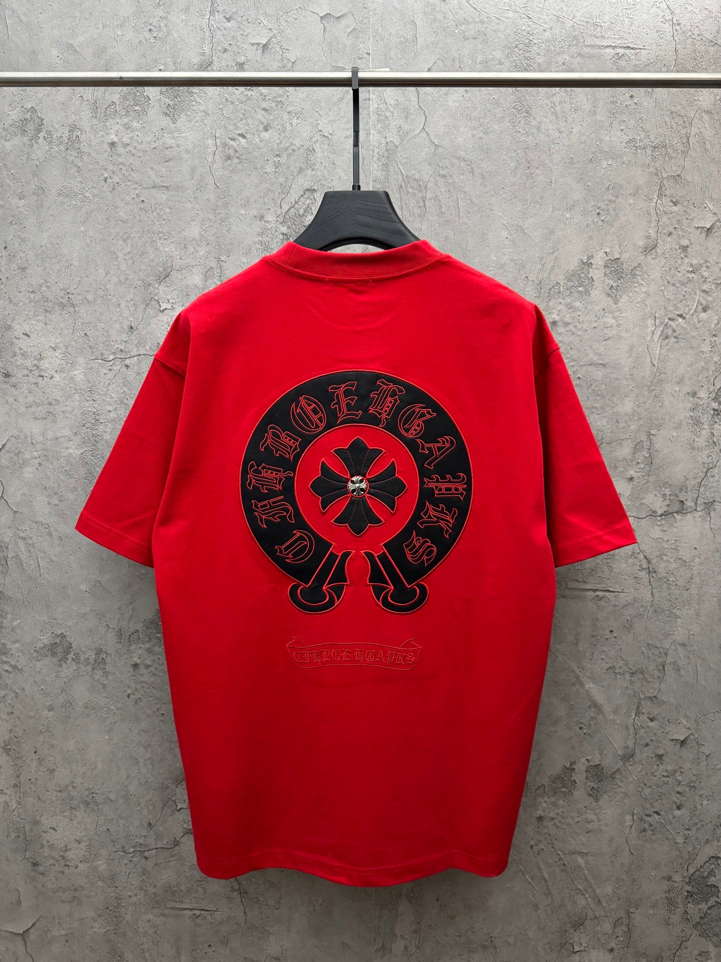Red crew-neck T-shirt with large back graphic circular emblem
