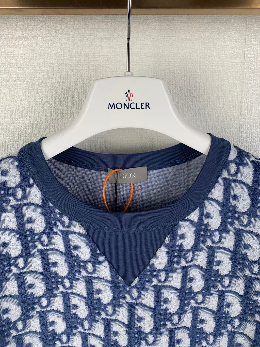 Short-sleeve T-shirt neckline close-up with navy V-neck rib trim