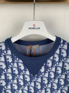 Short-sleeve T-shirt neckline close-up with navy V-neck rib trim