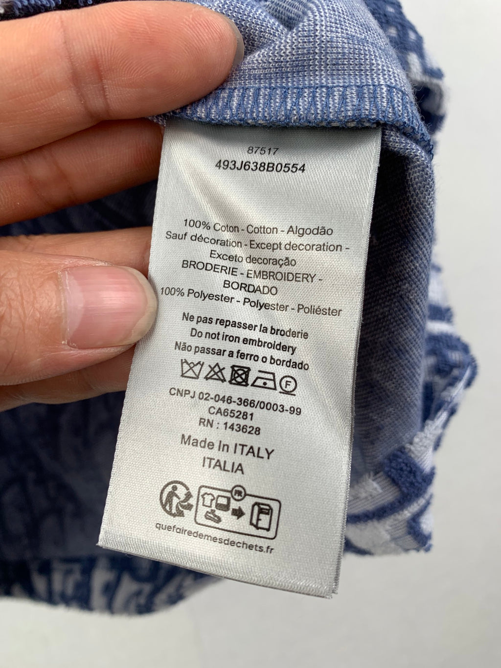 Inside neck care label on short-sleeve T-shirt, cotton and polyester blend