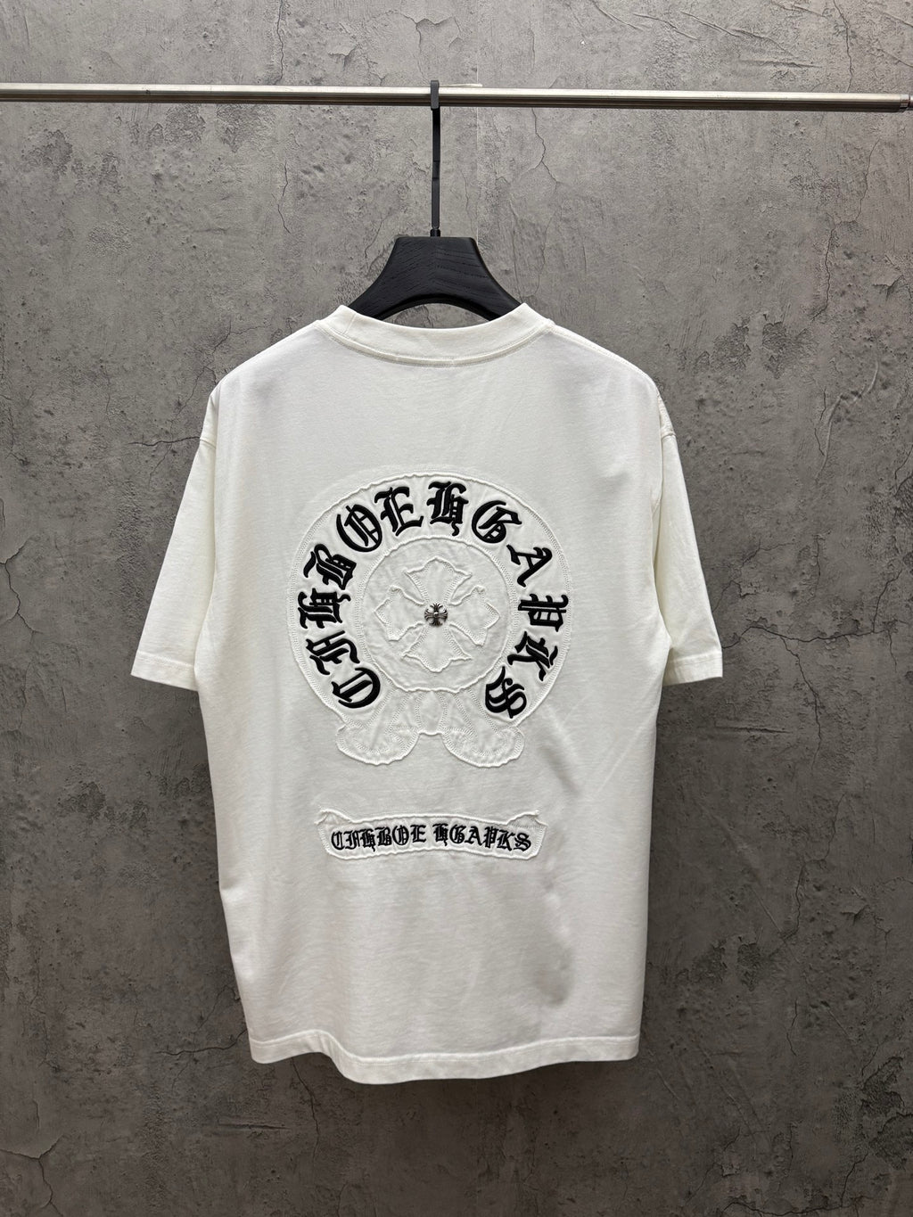 White short-sleeve T-shirt with large back graphic and logo text