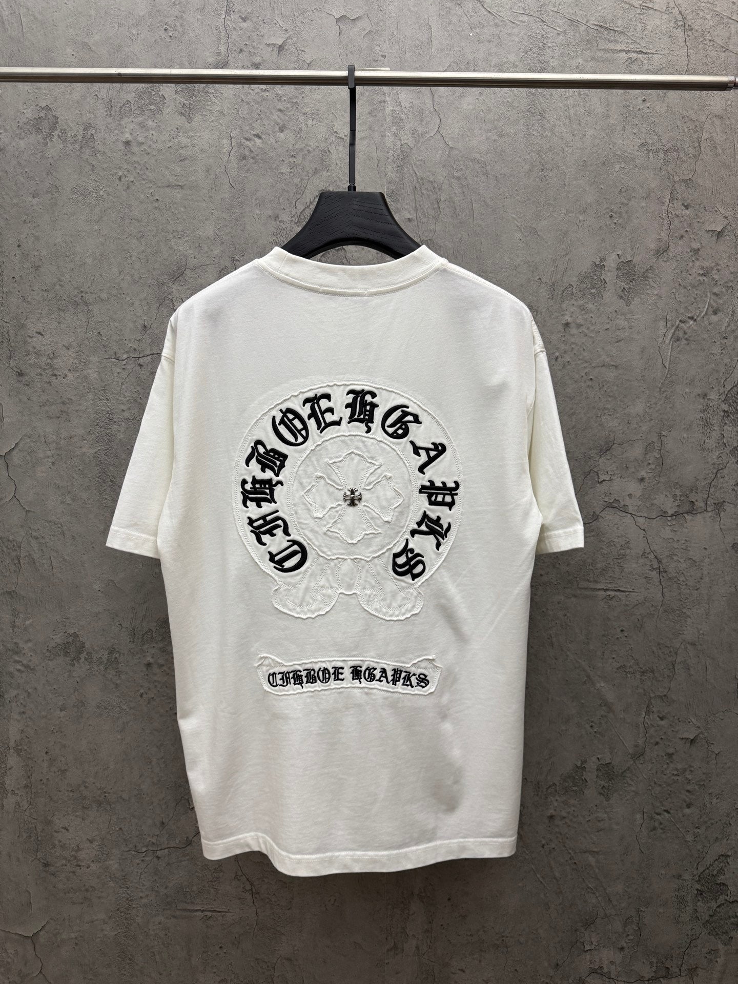 White short-sleeve T-shirt with large back graphic and logo text