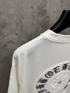 White short-sleeve T-shirt back shoulder view with partial circular logo embroidery