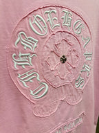 Pink T-shirt close-up of large back embroidered circular crest and beaded center