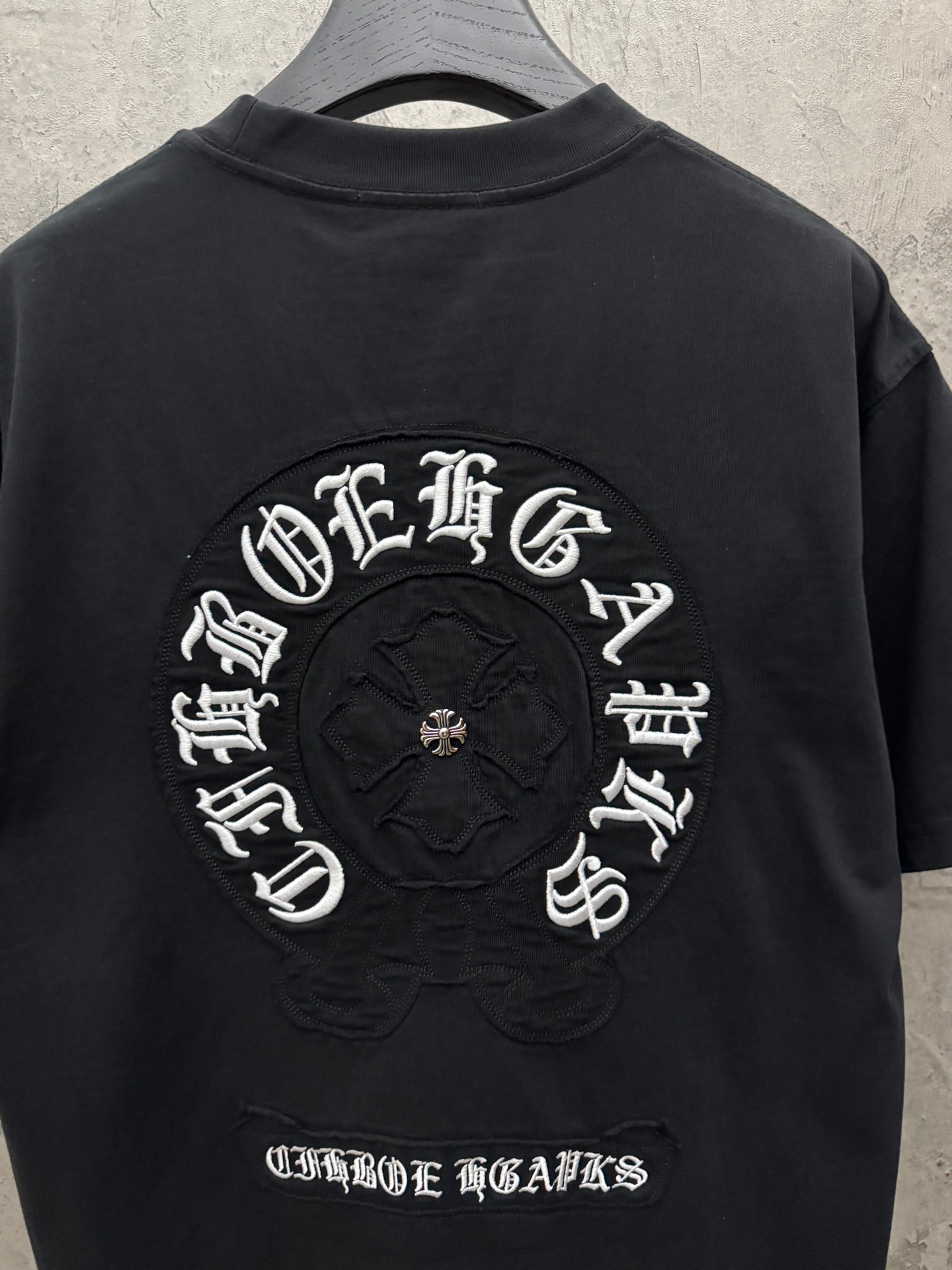 Chrome short-sleeve T-shirt back view with large circular embroidered graphic