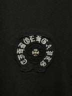 Chrome short-sleeve T-shirt close-up of circular embroidered emblem with bead detail
