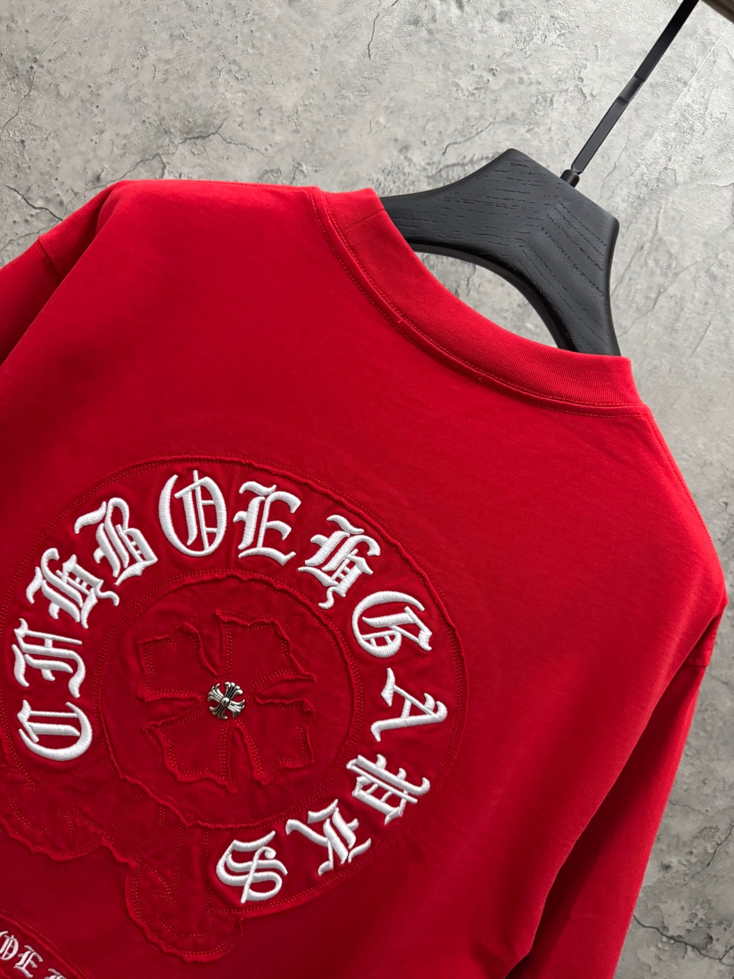 Red crewneck T-shirt with large back embroidered circular patch