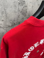 Red T-shirt with ribbed collar and partial back embroidery near shoulder