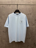 Light blue crewneck T-shirt with small embroidered chest crest