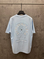 Light blue crewneck short-sleeve T-shirt with large back embroidered crest and text