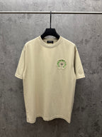 Cream crewneck T-shirt with small green embroidered crest on the chest