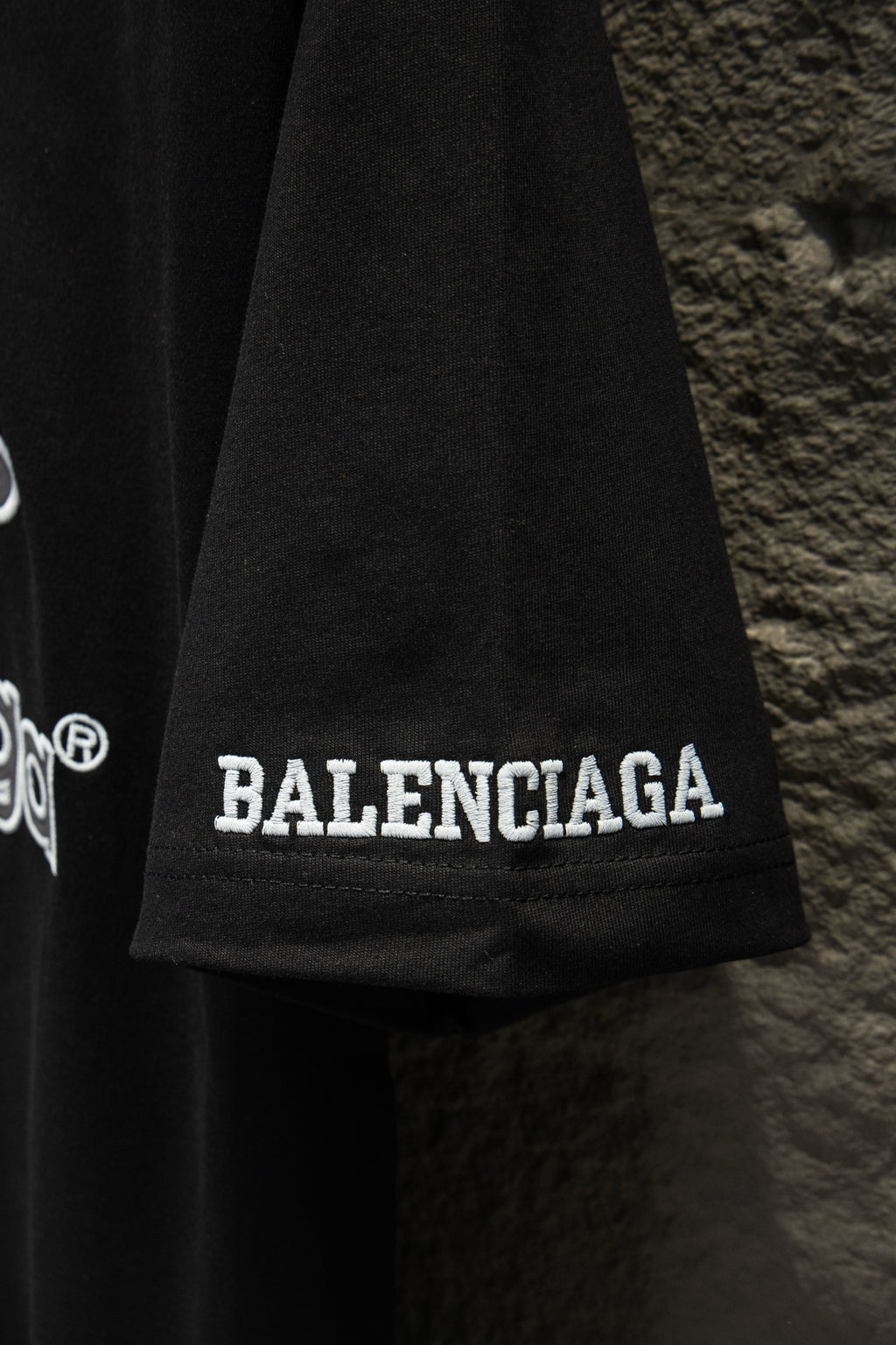 Balenciaga black polo shirt hem with BALENCIAGA lettering
