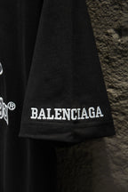 Balenciaga black polo shirt hem with BALENCIAGA lettering