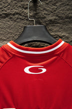 Red Balenciaga jersey neckline with ribbed white trim and small oval G logo