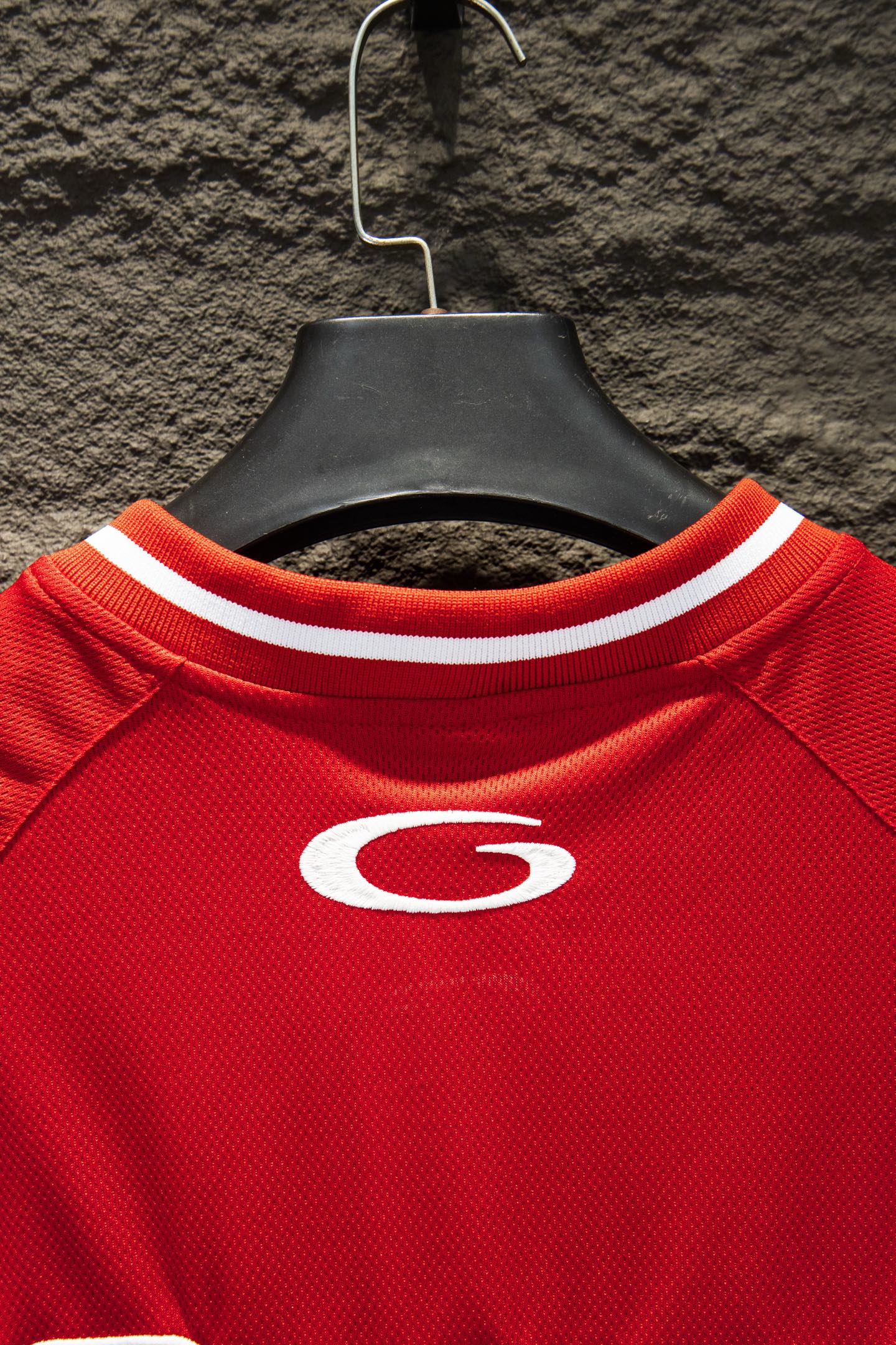 Red Balenciaga jersey neckline with ribbed white trim and small oval G logo