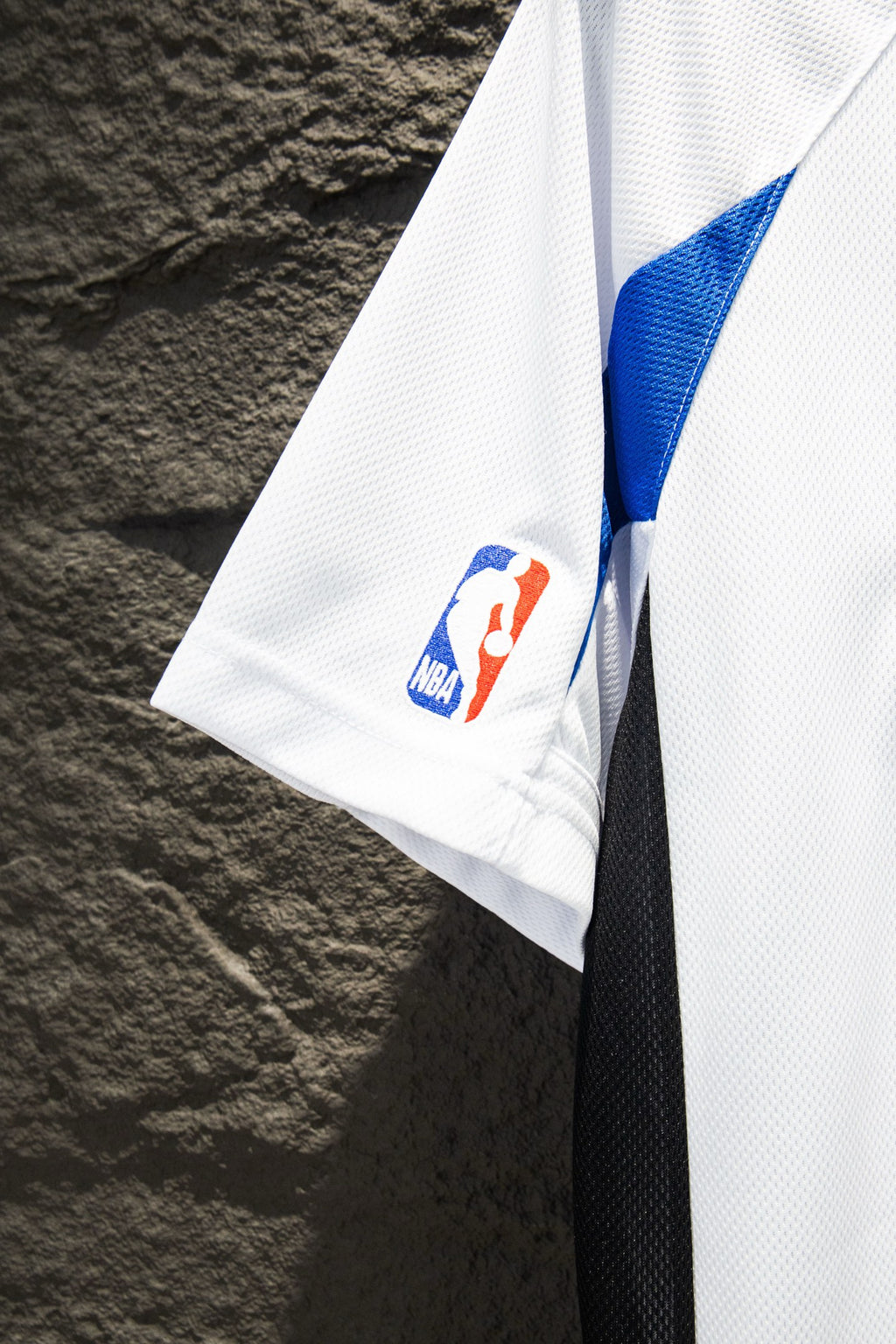 Balenciaga short-sleeve jersey sleeve, white with small blue NBA patch detail.