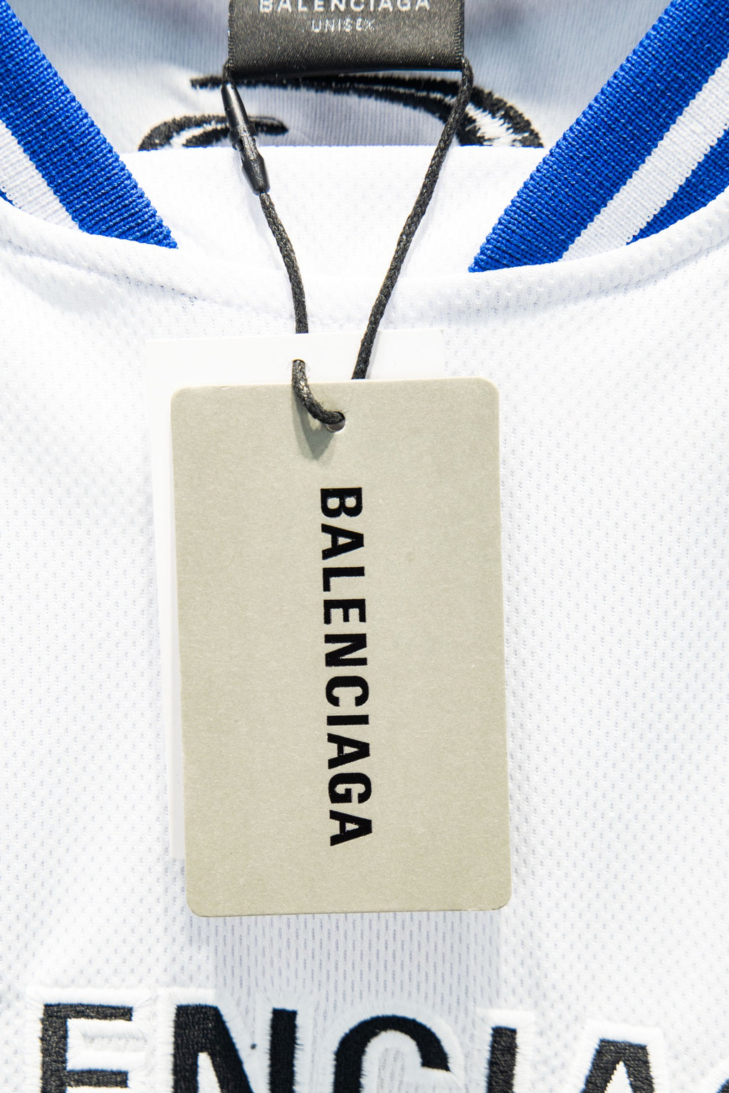 Balenciaga garment hang tag with BALENCIAGA printed vertically