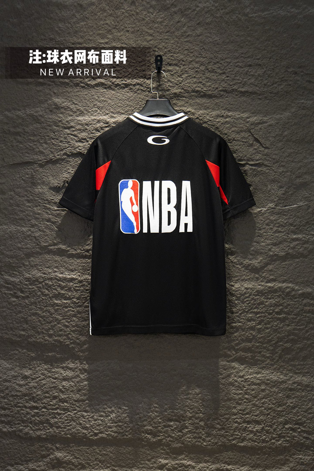 Black short-sleeve jersey with NBA logo and red shoulder accents