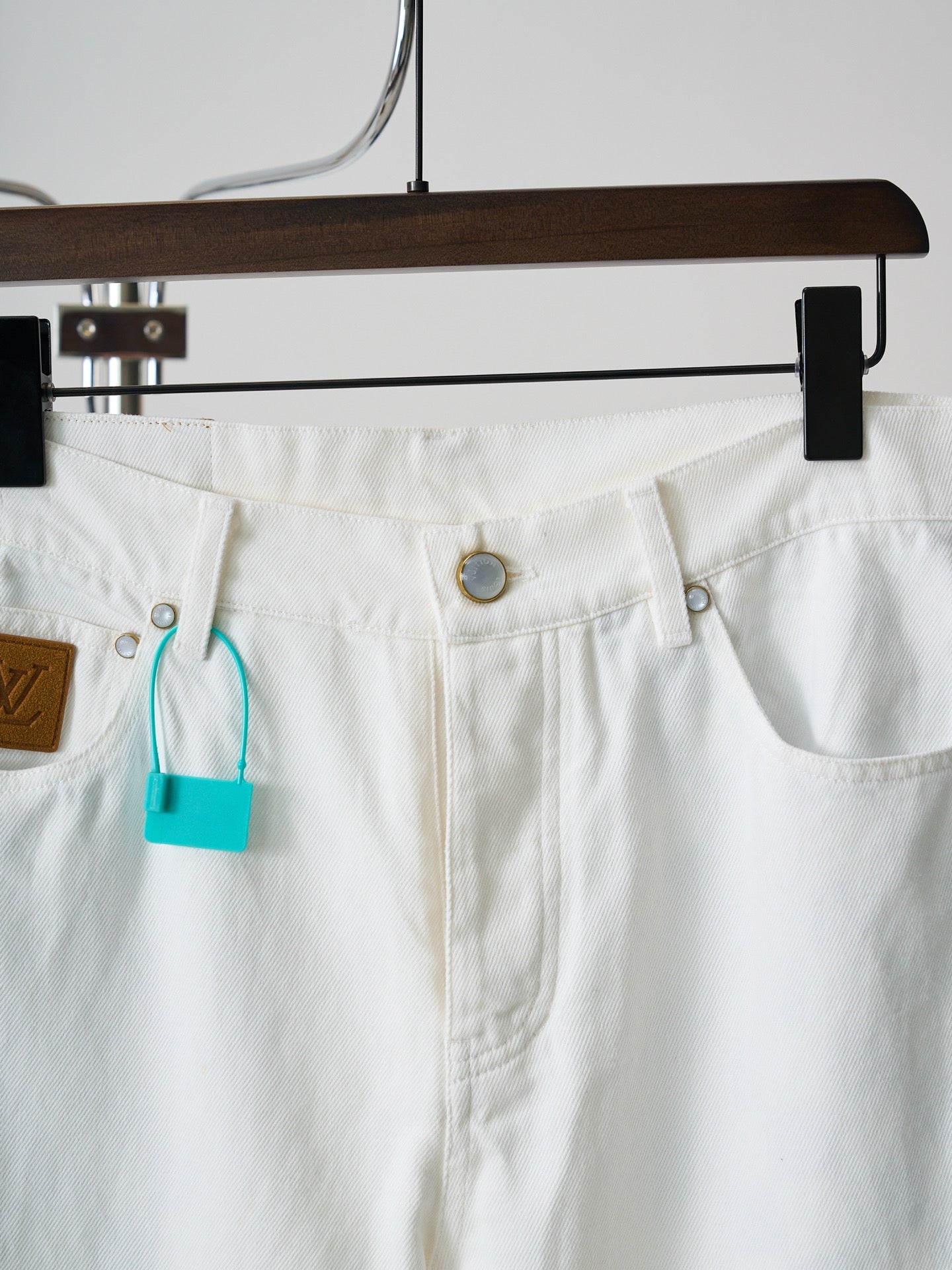 Louis Vuitton white denim waistband with button and pocket detailing