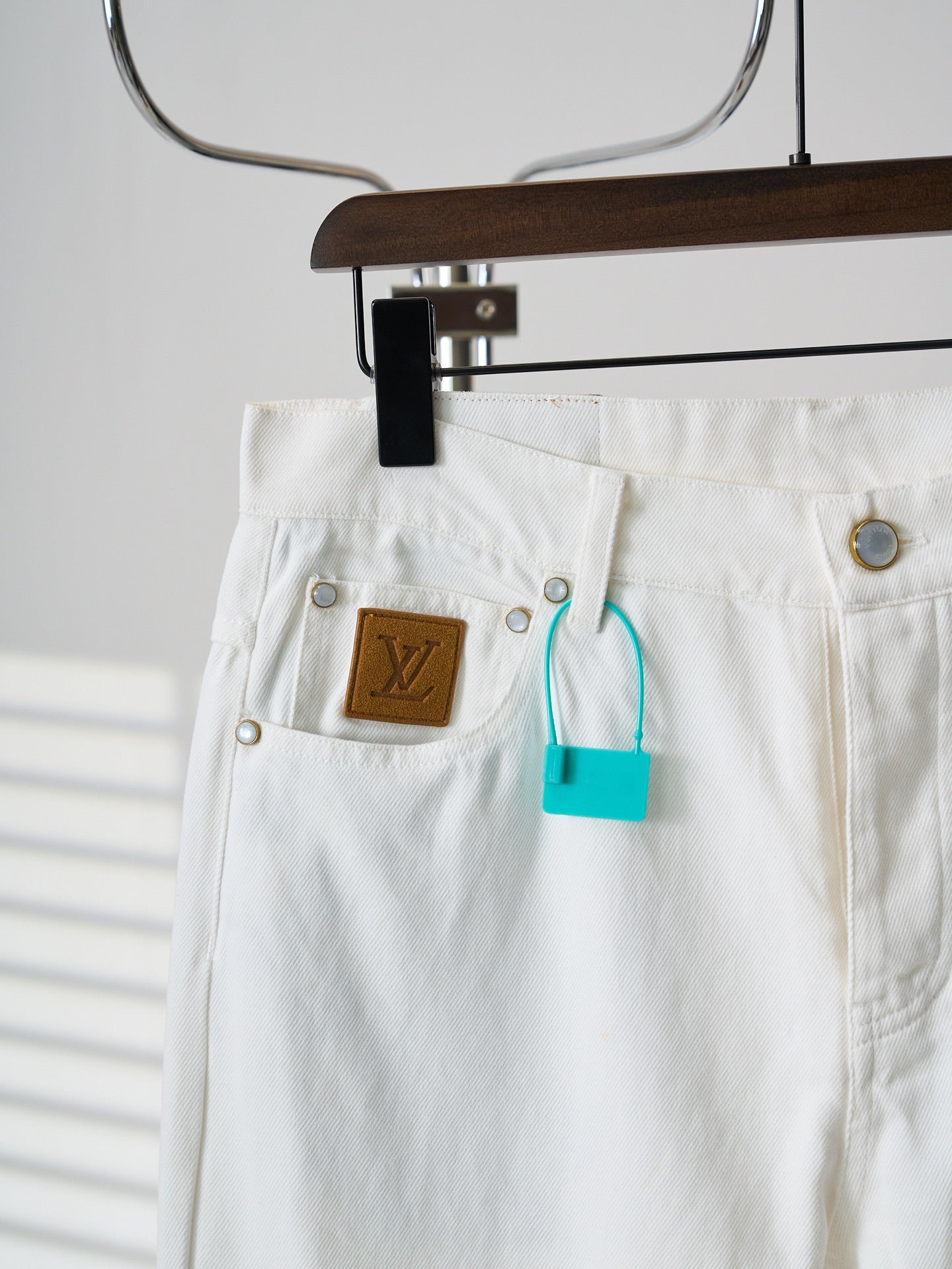 Louis Vuitton white denim pants with LV logo patch pocket and belt loops