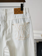 Louis Vuitton white denim pants with brown check logo patch and LV emblem