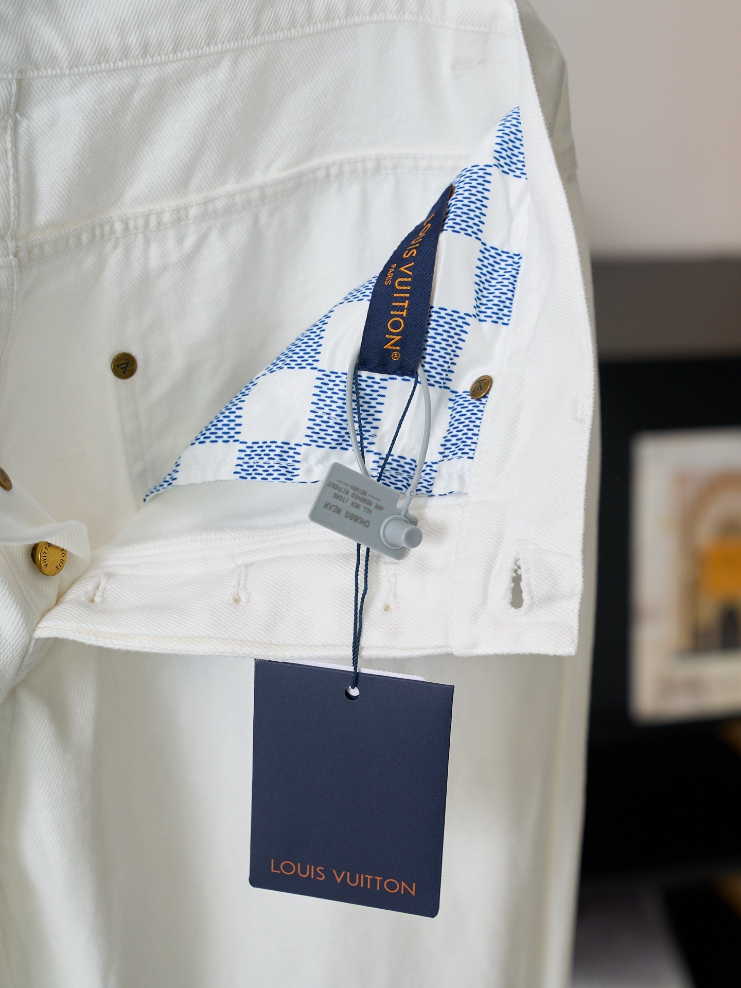 Louis Vuitton white denim pants with blue check pocket lining and gold button