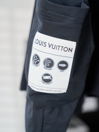 Louis Vuitton navy shorts with size label and care icons on inner pocket