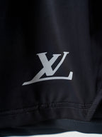Louis Vuitton dark navy shorts with white LV logo on leg hem