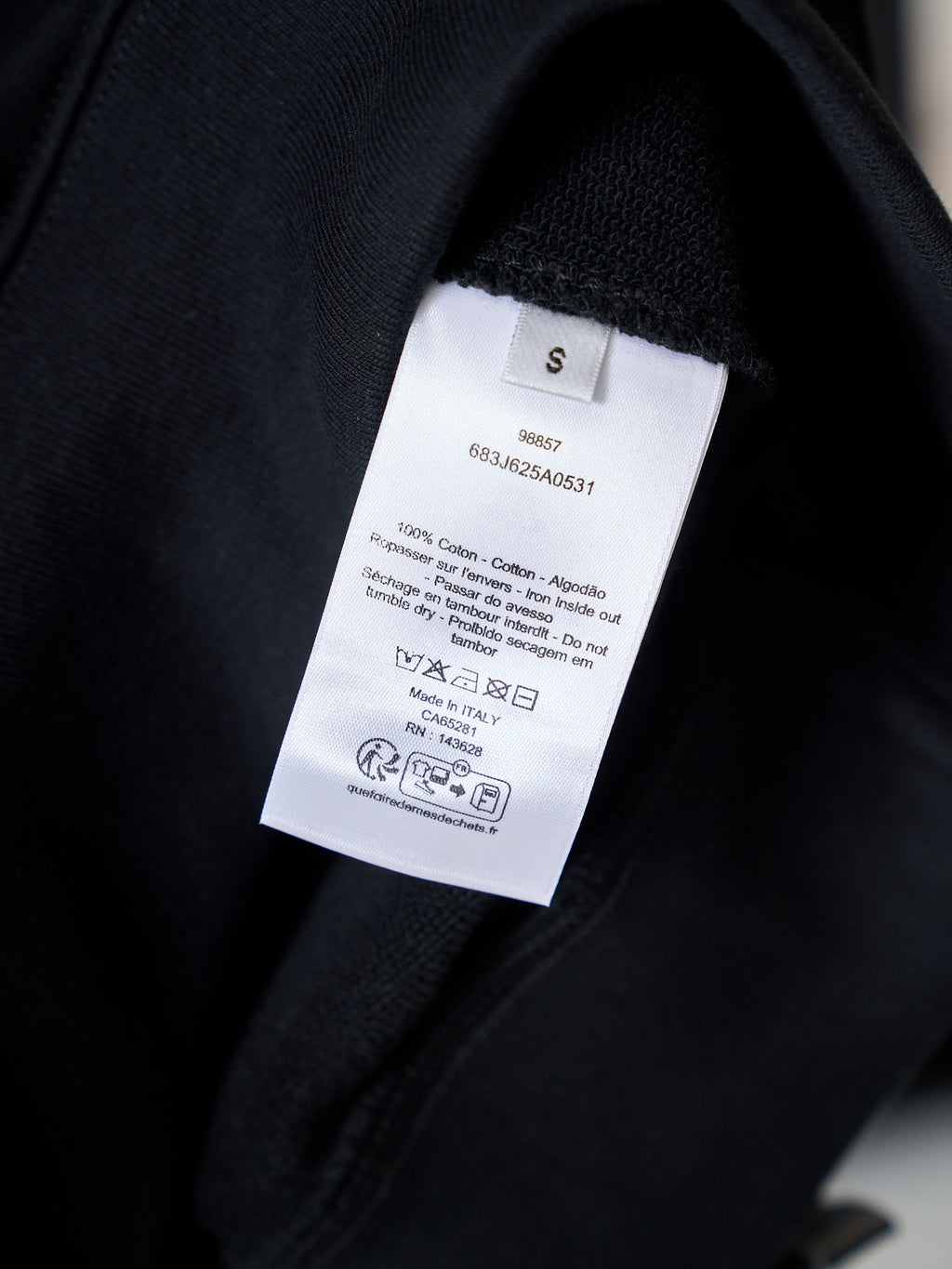 Black sweatshirt with interior size and care label tag