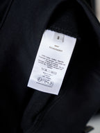 Black sweatshirt with interior size and care label tag