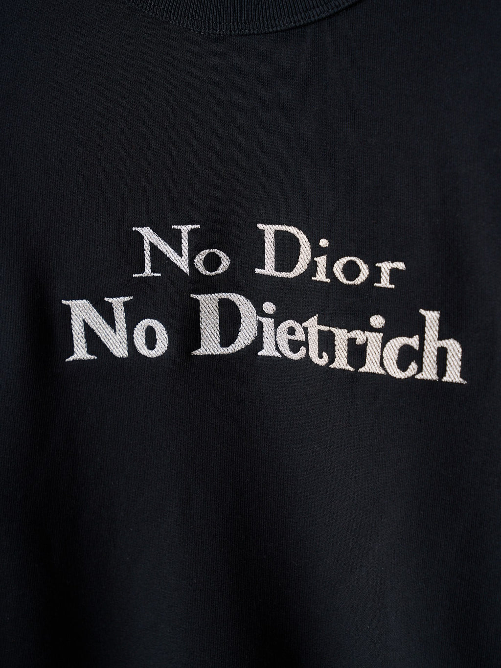 Black sweatshirt chest print reading 'No Dior No Dietrich'