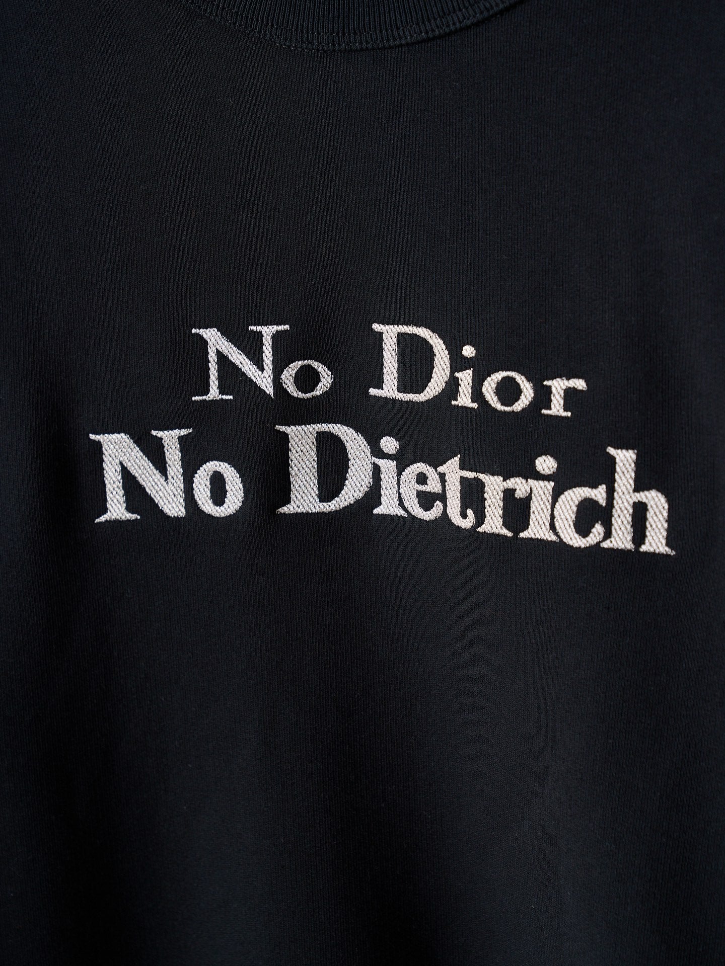 Black sweatshirt chest print reading 'No Dior No Dietrich'