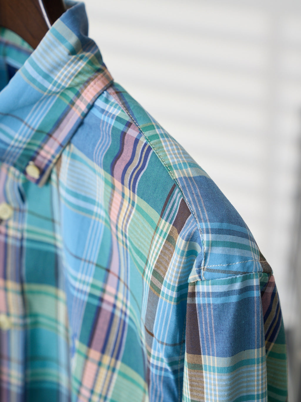 Plaid shirt shoulder seam and sleeve with buttoned placket