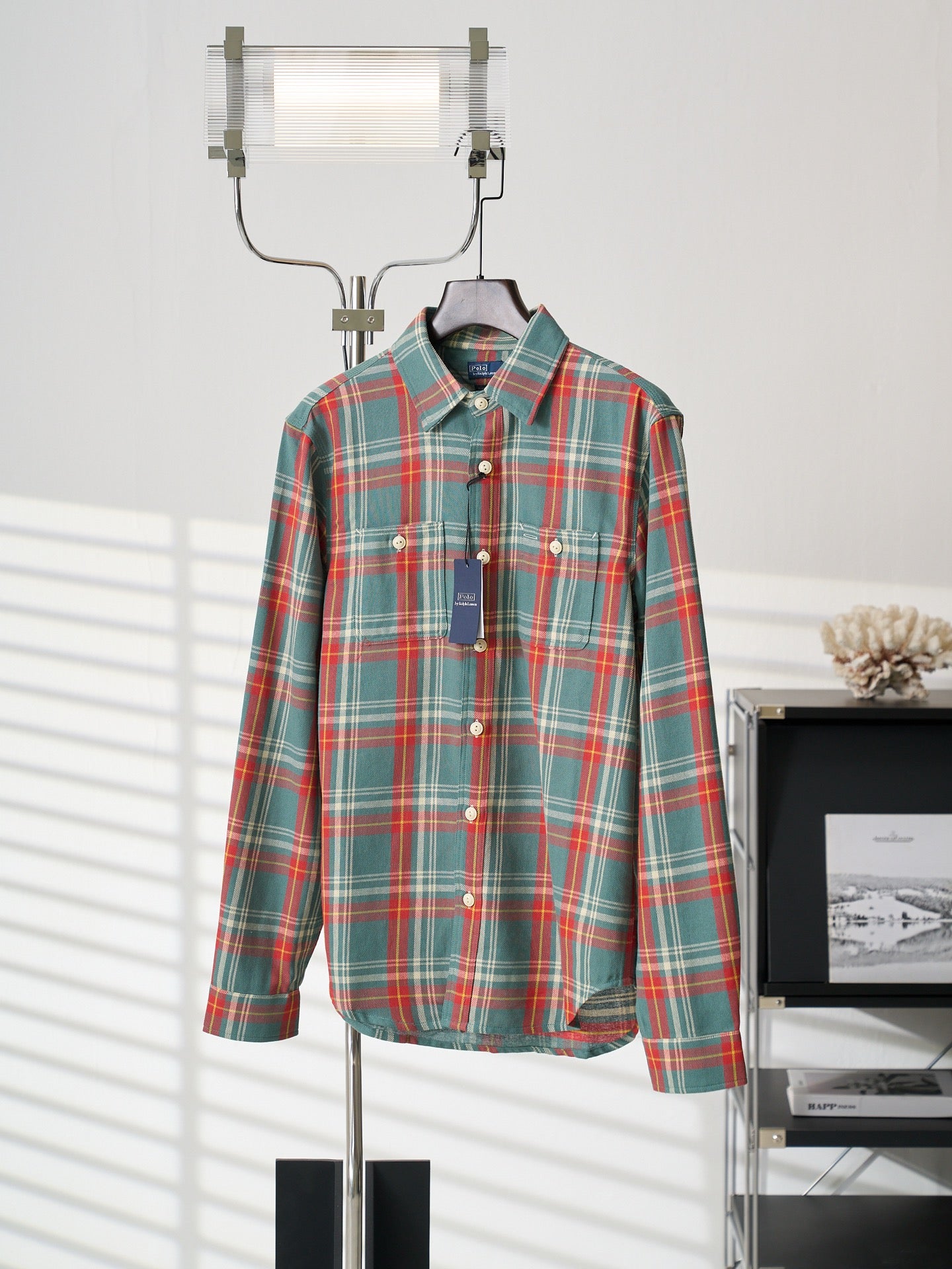 Teal plaid button-up shirt on hanger, front view with pointed collar and button placket