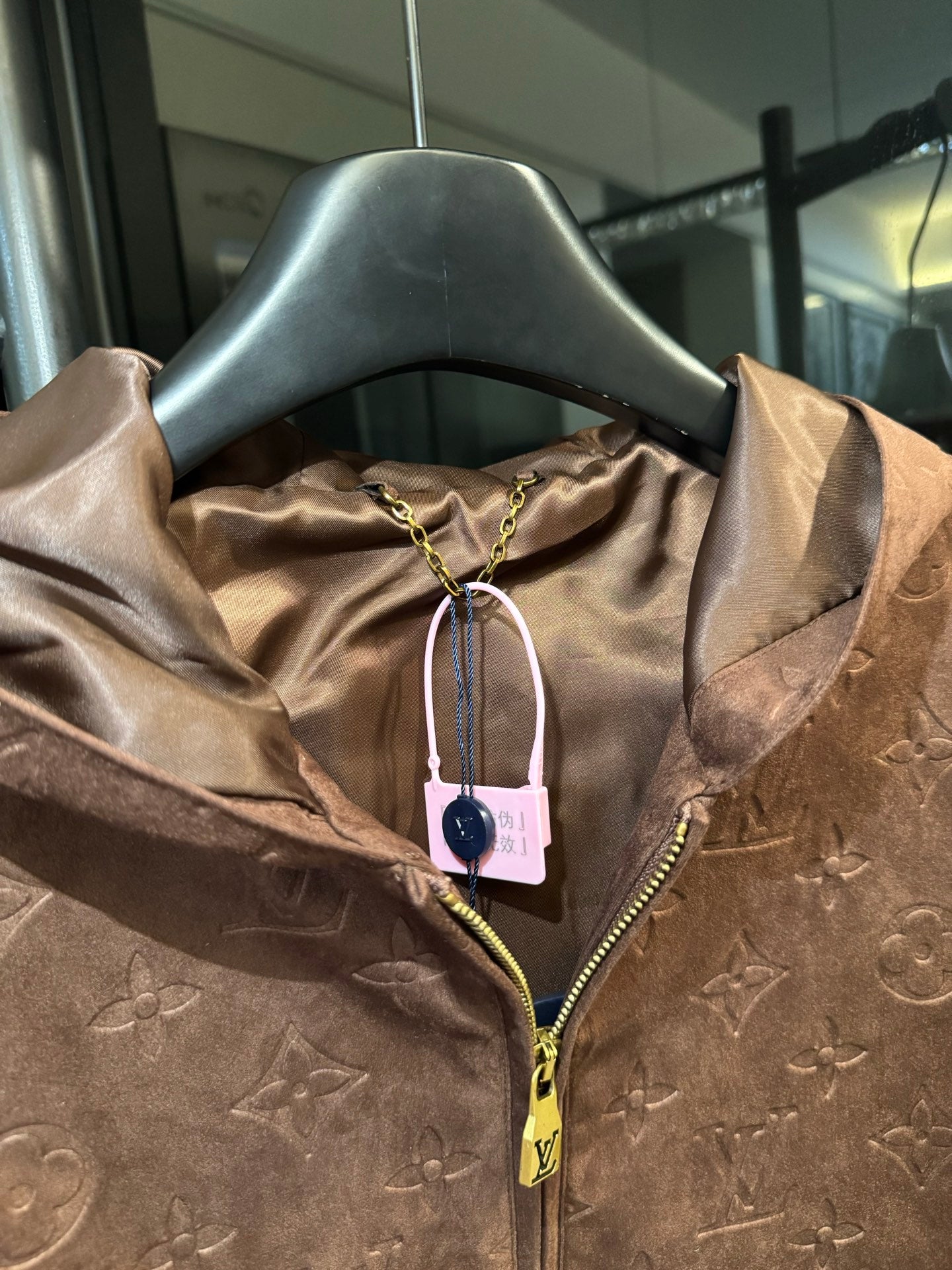Louis Vuitton monogram hooded jacket, brown, hood lining with hanging tag and zipper pull