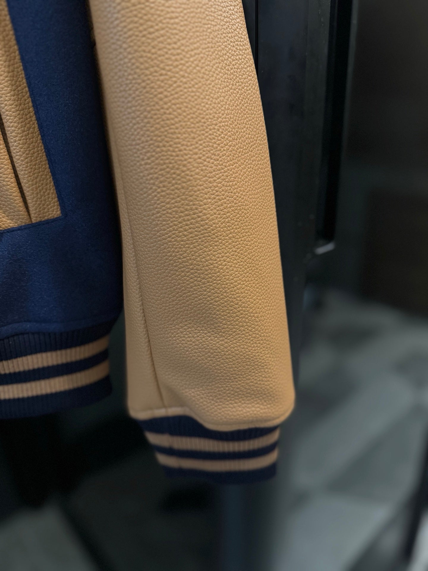 Long varsity jacket tan leather-look sleeve with striped rib cuff
