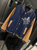 Long varsity jacket with multicolor LV crest, tan pocket accents, striped cuffs and hem